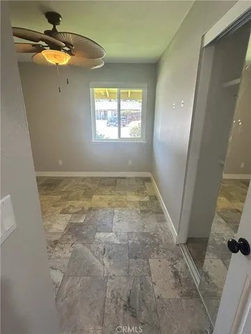 a view of an empty room with a window