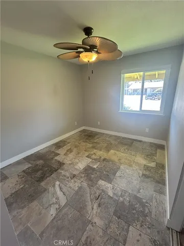 a view of an empty room and a window