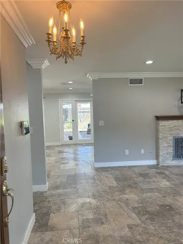 a view of an empty room with a fireplace