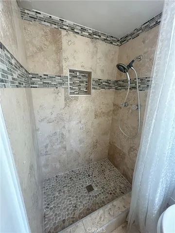 an empty room with a empty space and windows