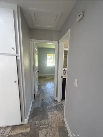 a kitchen with stainless steel appliances granite countertop a refrigerator and a stove