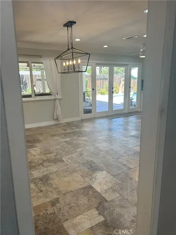 a kitchen with a stove and a refrigerator