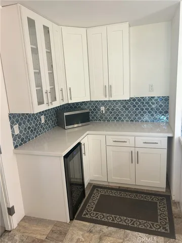 a room with lots of wooden furniture and a porch