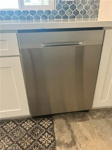 a view of a house with a yard fire pit and outdoor seating