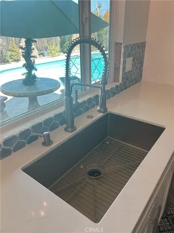 a view of a hallway with a chandelier