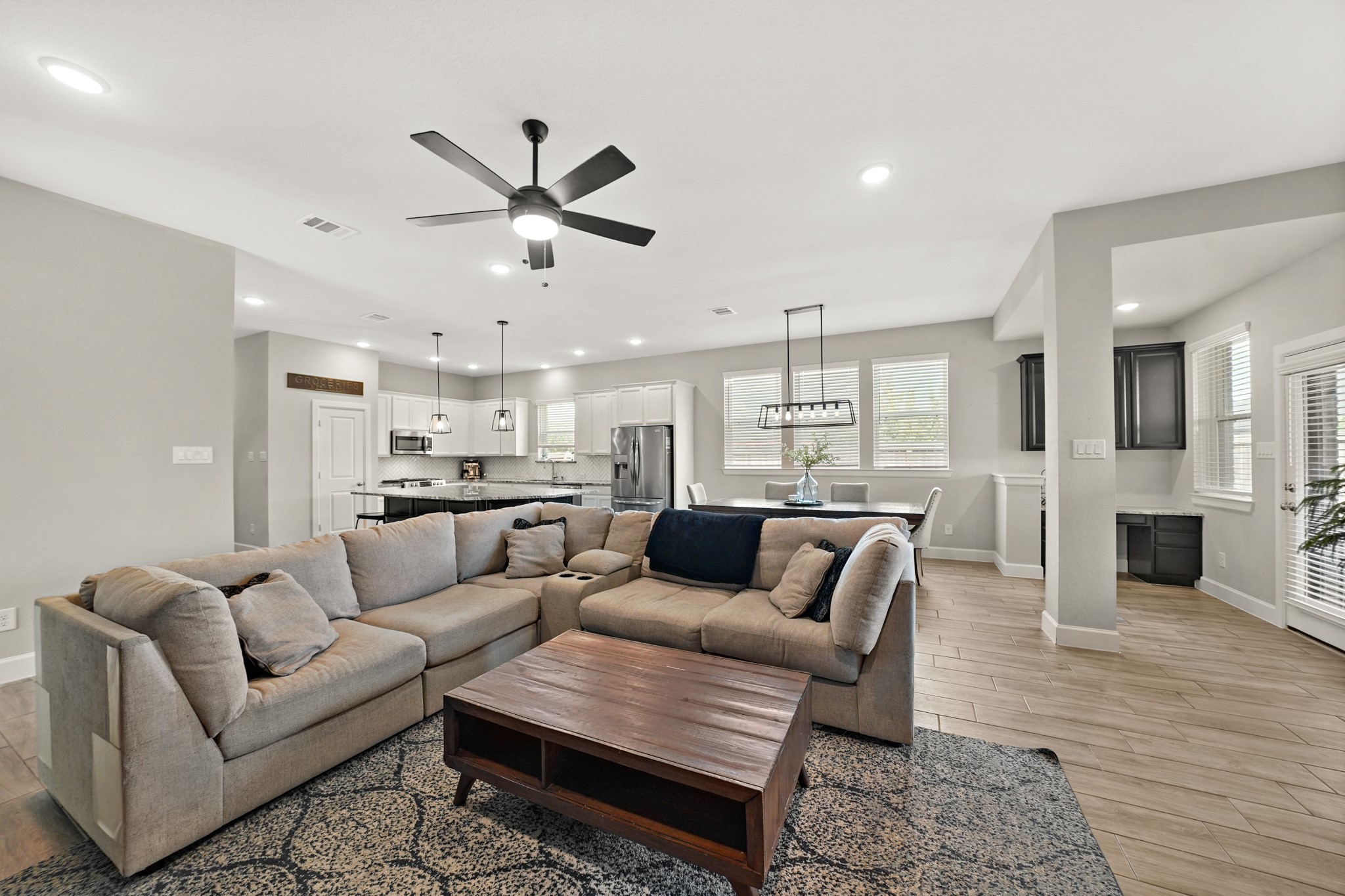 6635 Waxbill Road Katy, TX 77493 - Photo 13 of 33 a living room with furniture and a view of kitchen