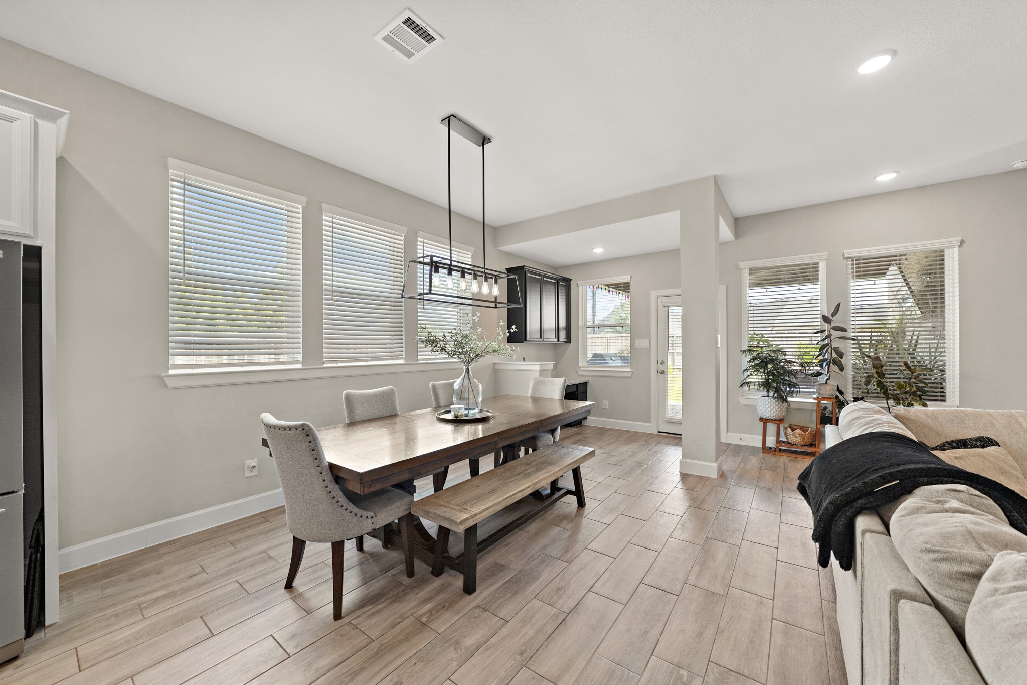 6635 Waxbill Road Katy, TX 77493 - Photo 14 of 33 a living room with furniture and a wooden floor