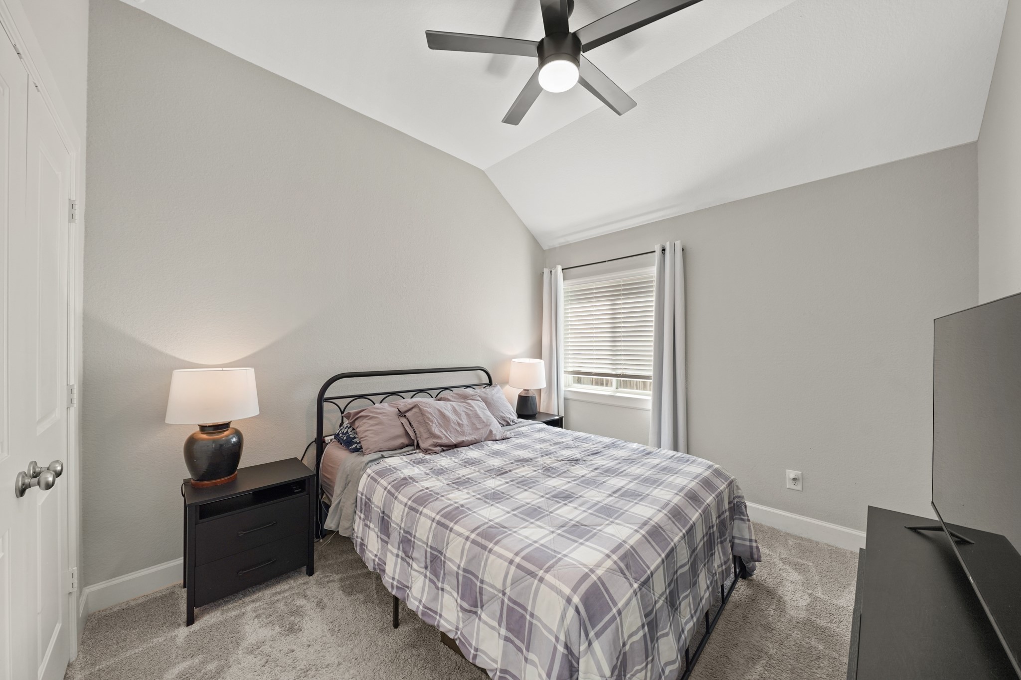 6635 Waxbill Road Katy, TX 77493 - Photo 20 of 33 a bedroom with a bed and a chandelier