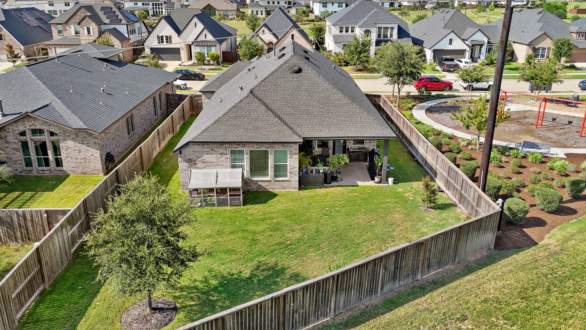 6635 Waxbill Road Katy, TX 77493 - Photo 28 of 33 a view of house with swimming pool outdoor seating