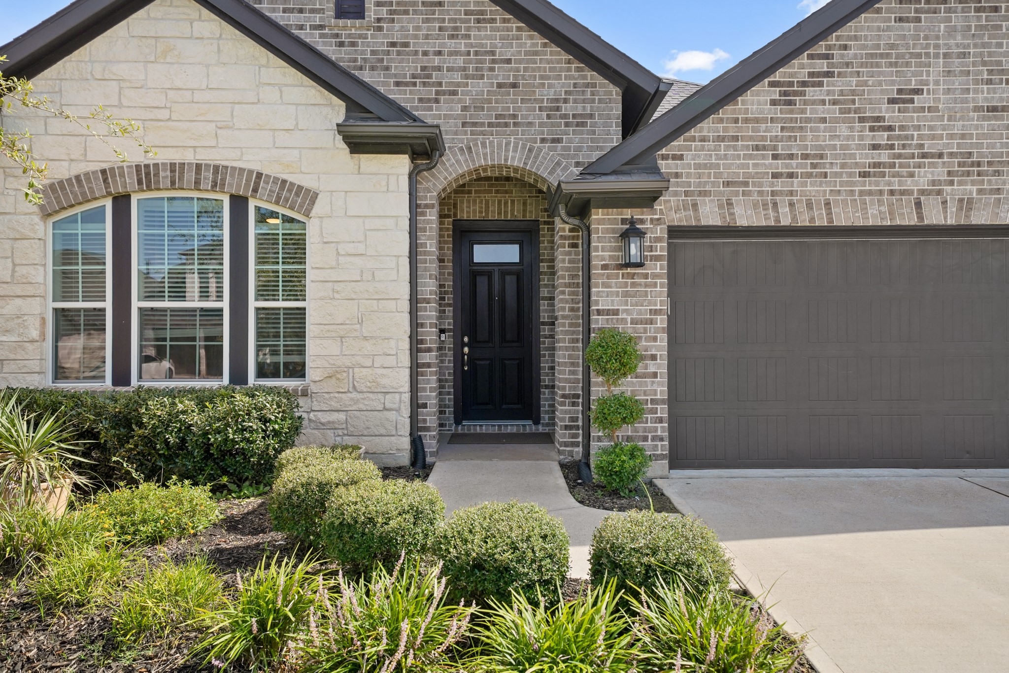 6635 Waxbill Road Katy, TX 77493 - Photo 4 of 33 a front view of a house with garden