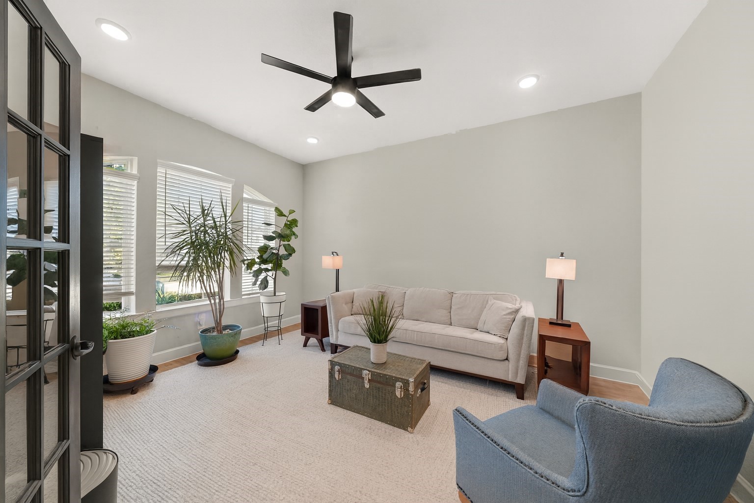 6635 Waxbill Road Katy, TX 77493 - Photo 6 of 33 a living room with furniture a chandelier and a view of living room
