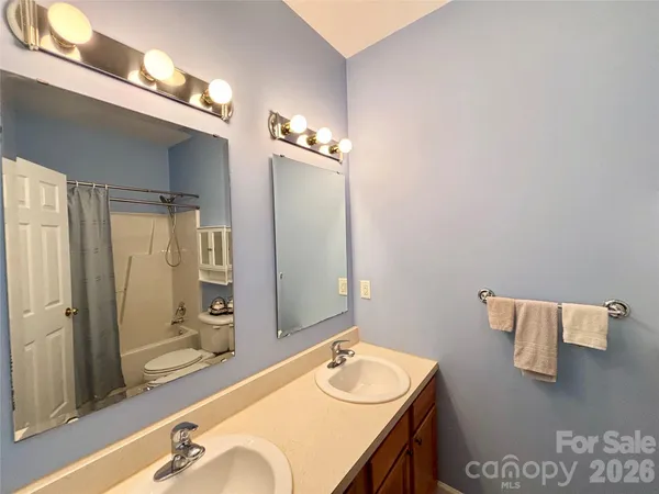 a bathroom with a toilet and shower