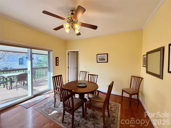 a bedroom with a bed and a ceiling fan