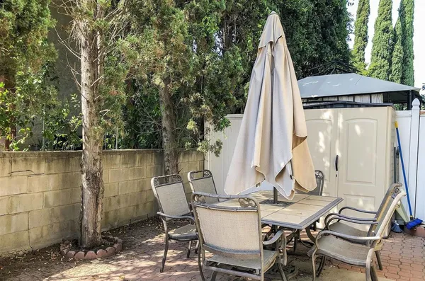 a view of a lake with a table and chairs