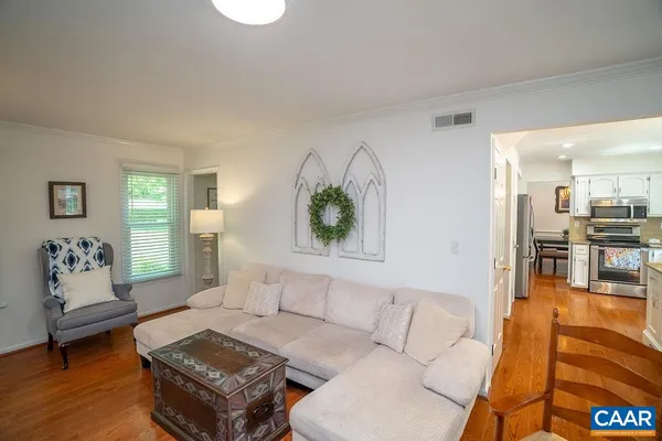 a bedroom with furniture and a flat screen tv