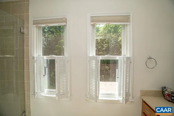a view of a room with window and cabinet