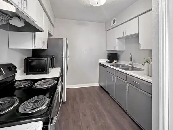 a kitchen with a stove and a sink