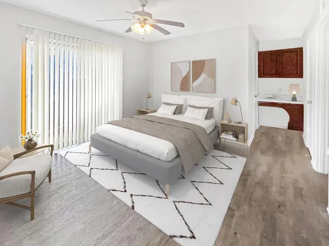 a bedroom with a bed and a television