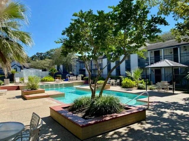 a view of a backyard with sitting area