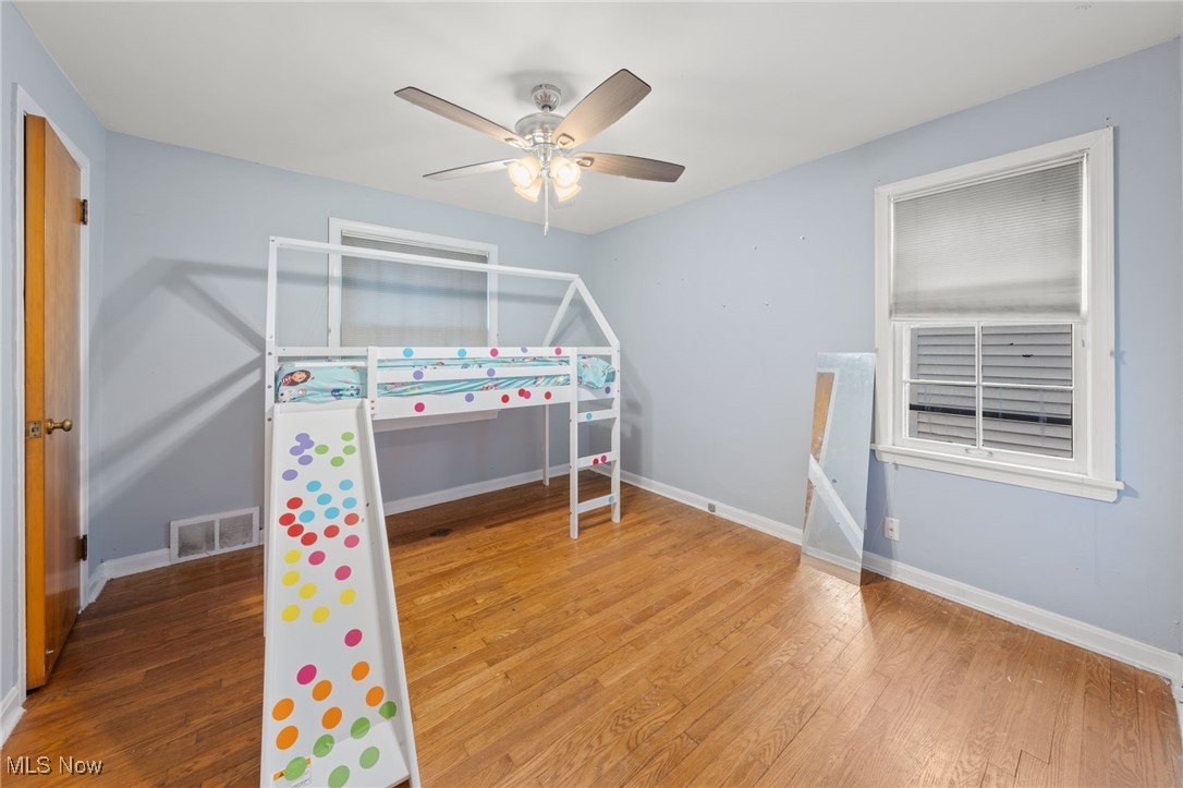 4146 Wyncote Road South Euclid, OH 44121 - Photo 12 of 20 Bedroom with baseboards, visible vents, a ceiling fan, and wood finished floors