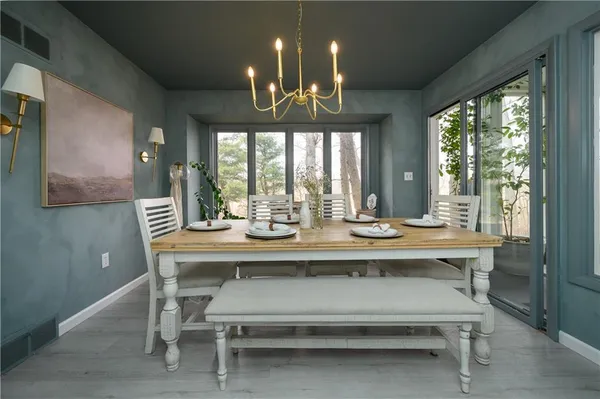 a view of a dining room with furniture window and outside view
