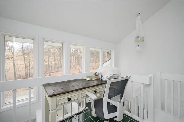 a view of a dining room with furniture and window