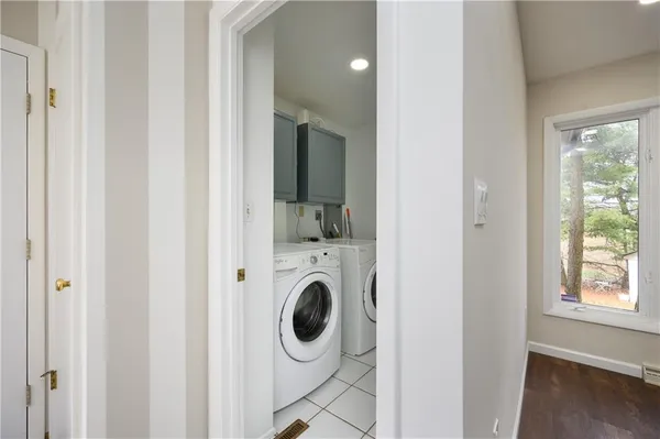 a view of a hallway with washer and dryer