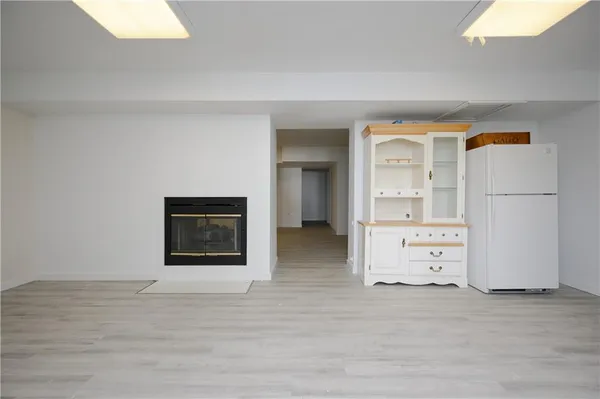 a view of a kitchen with storage and utility room