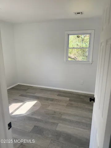 a white toilet sitting next to a bathroom sink and tub