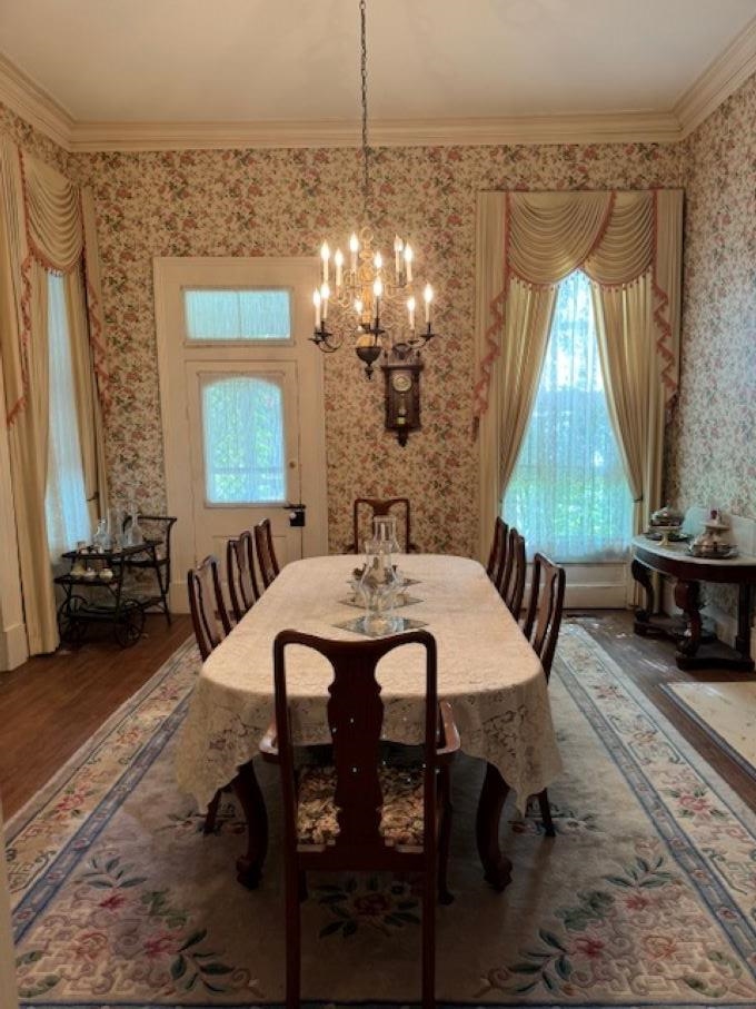 23840 Highway 57 La Grange, TN 38046 - Photo 11 of 15 18x18 dining room will accommodate all the family for the holidays, Features fireplace, crown molding, a chandelier, and hardwood / wood flooring, exterior entrance