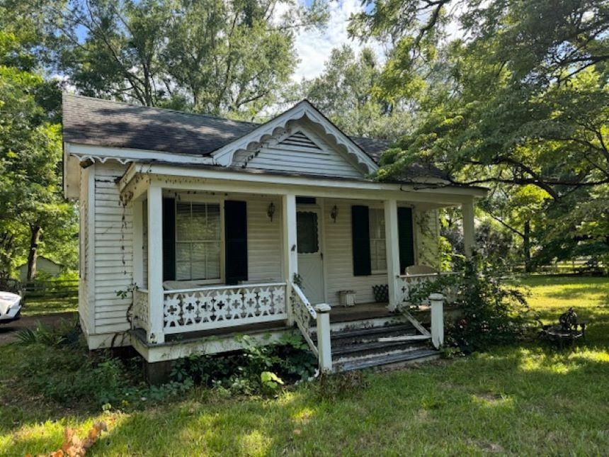 23840 Highway 57 La Grange, TN 38046 - Photo 4 of 15 Bungalow-style home featuring covered porch and a front yard