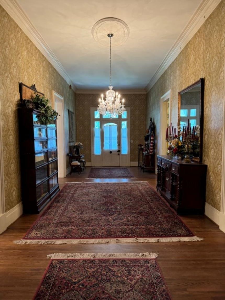 23840 Highway 57 La Grange, TN 38046 - Photo 5 of 15 Expansive 12x36 entry foyer with a notable chandelier, crown molding, and hardwood / wood-style floors