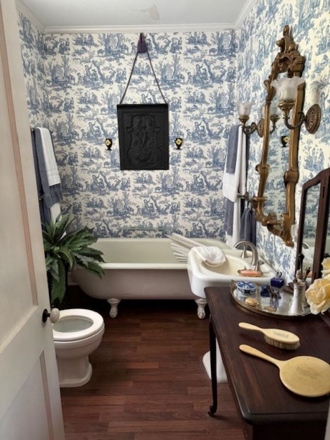 23840 Highway 57 La Grange, TN 38046 - Photo 8 of 15 Bathroom with ornamental molding, toilet, vanity, wood-type flooring, and original clawfoot tub