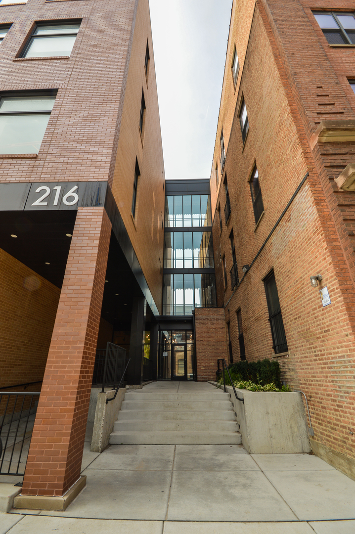 216 North May Street, Unit 101 Chicago, IL 60607 - Photo 1 of 19 a front view of a building