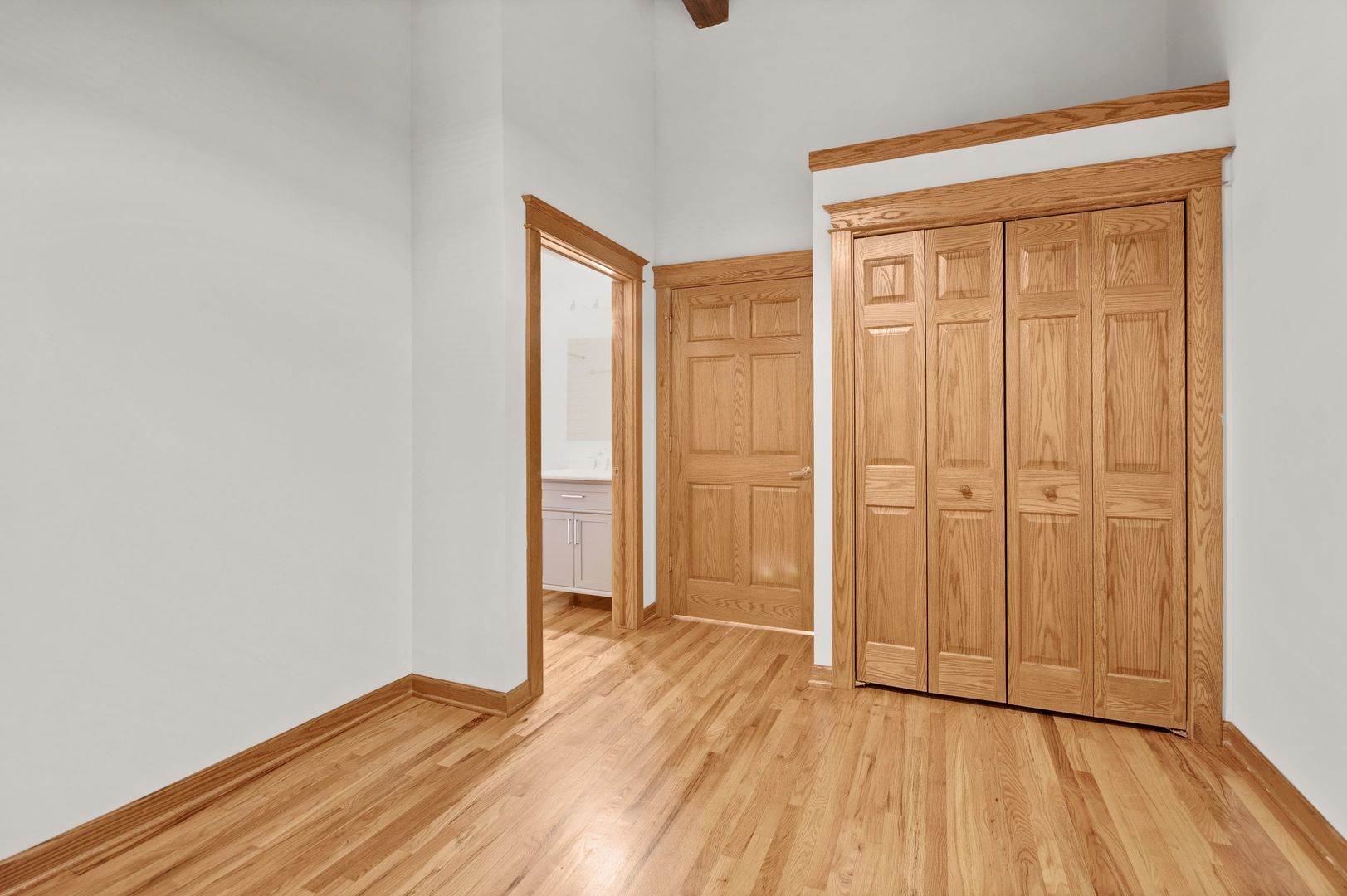 216 North May Street, Unit 101 Chicago, IL 60607 - Photo 11 of 19 an empty room with wooden floor and a window