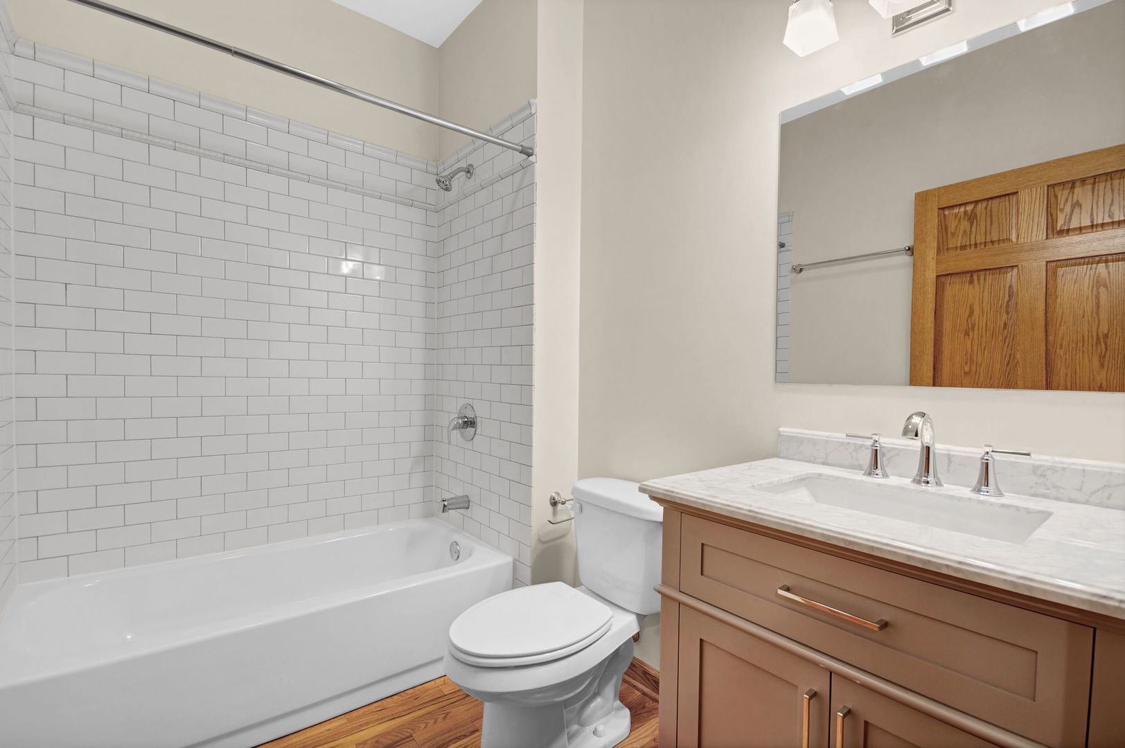 216 North May Street, Unit 101 Chicago, IL 60607 - Photo 17 of 19 a bathroom with a sink toilet and shower