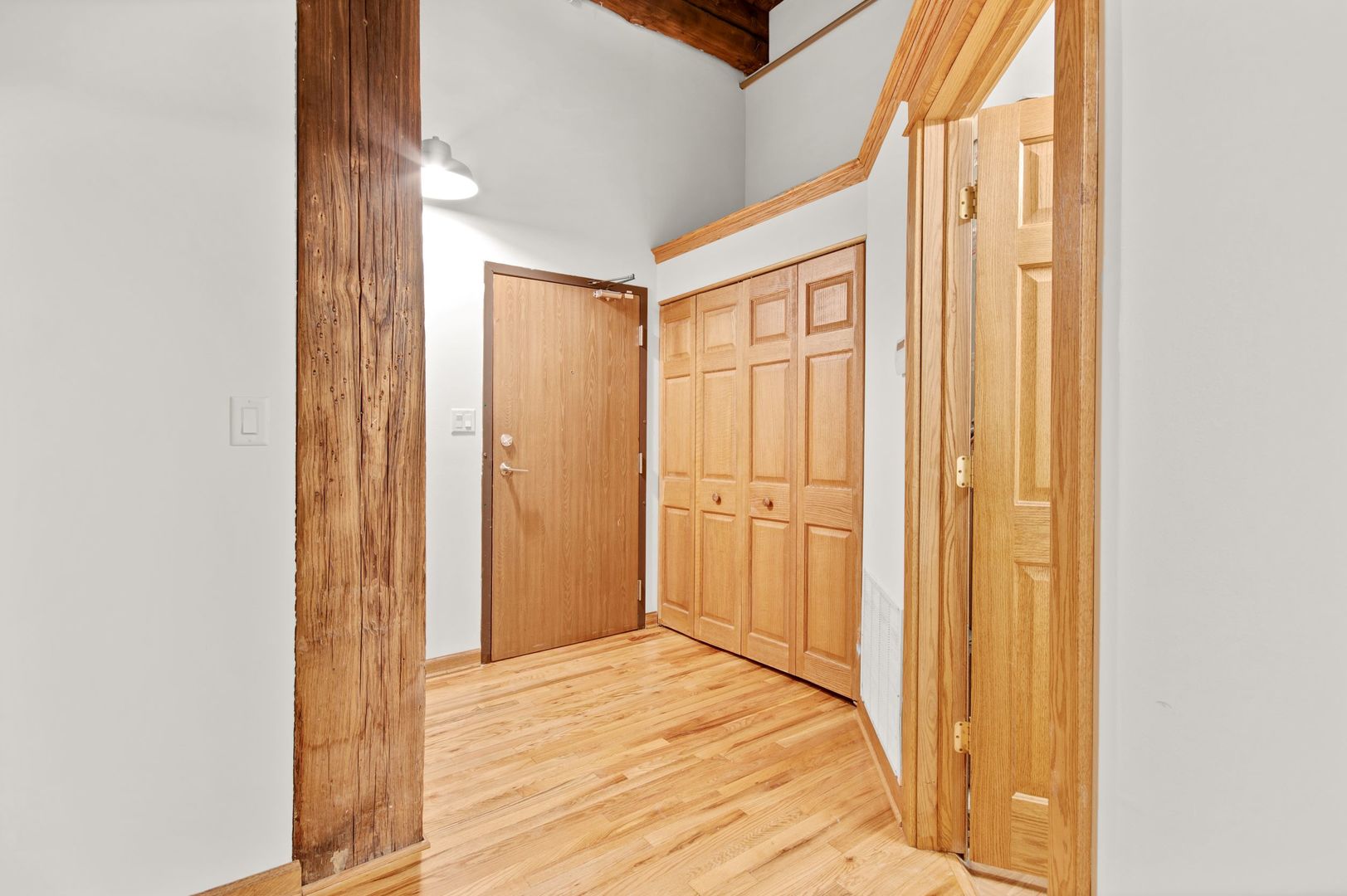 216 North May Street, Unit 101 Chicago, IL 60607 - Photo 8 of 19 a view of a hallway with wooden floor