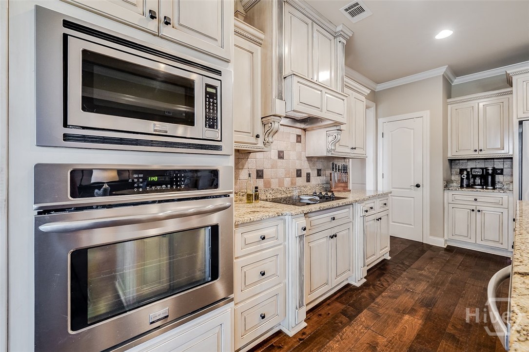 7 Reed Grass Lane Savannah, GA 31405 - Photo 16 of 70 Spice racks on both sides of the stove that pull out for easy access. A sellers favorite discovery when they moved into the home