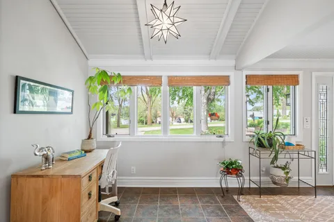 a room with a table and a potted plant