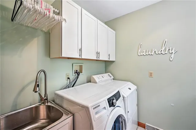 a view of storage and utility room with washer and dryer