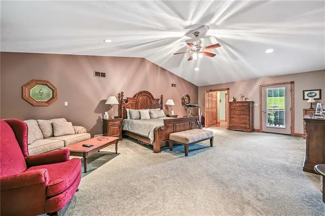 a living room with furniture a chandelier and a couch