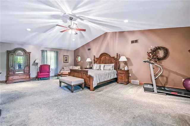 a bedroom with furniture and a chandelier