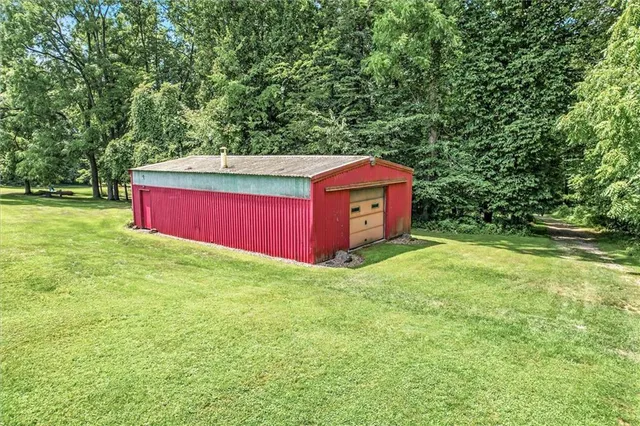 a view of a backyard with a barn