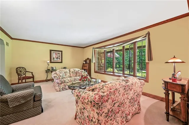 a spacious bedroom with a bed and a couch