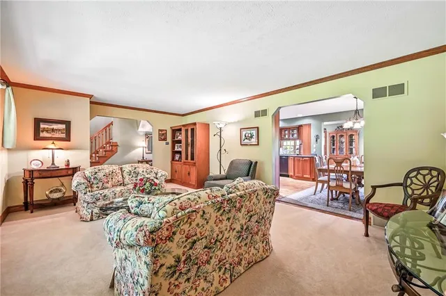 a bedroom with furniture and wooden floor