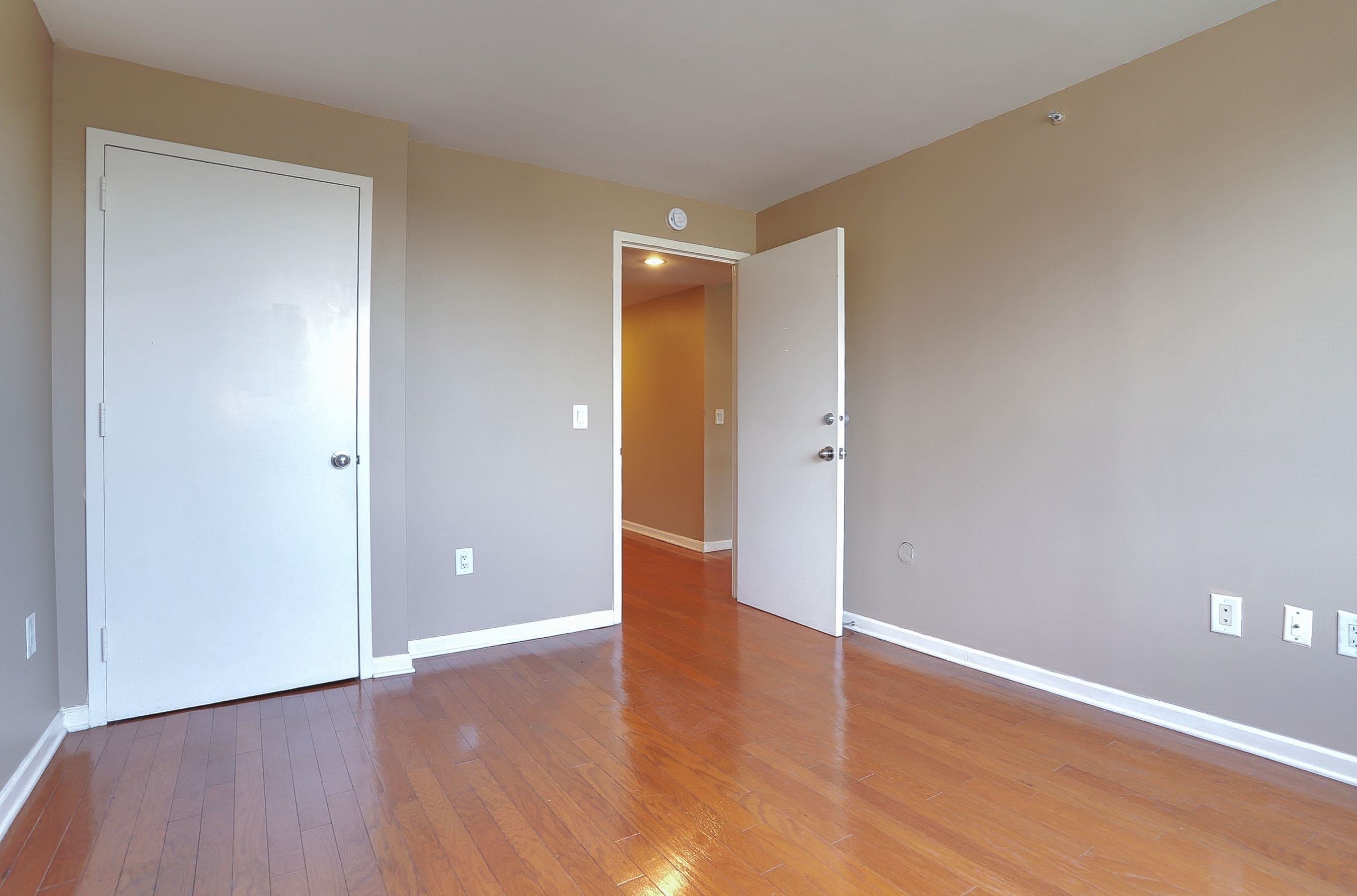 700 Grove Street, Unit 4F Jersey City, NJ 07310 - Photo 14 of 30 a view of an empty room with wooden floor