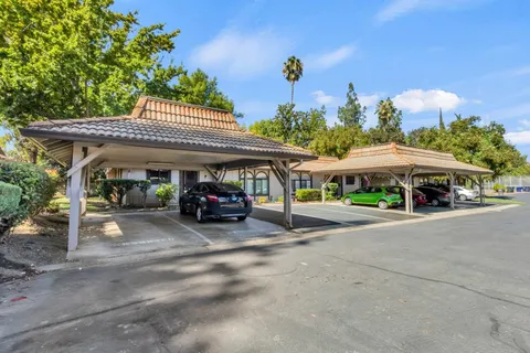 a view of a table and chairs in the patio