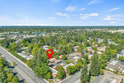 an aerial view of a house with a big yard