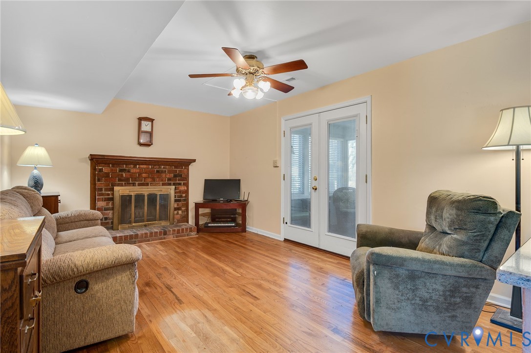 8994 Becton Road Glen Allen, VA 23060 - Photo 12 of 29 Casual living area with fireplace, light wood fini