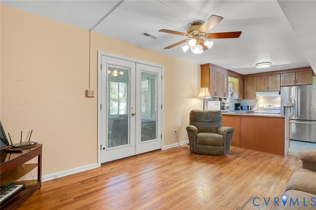 8994 Becton Road Glen Allen, VA 23060 - Photo 14 of 29 Casual living area with light wood finished floors
